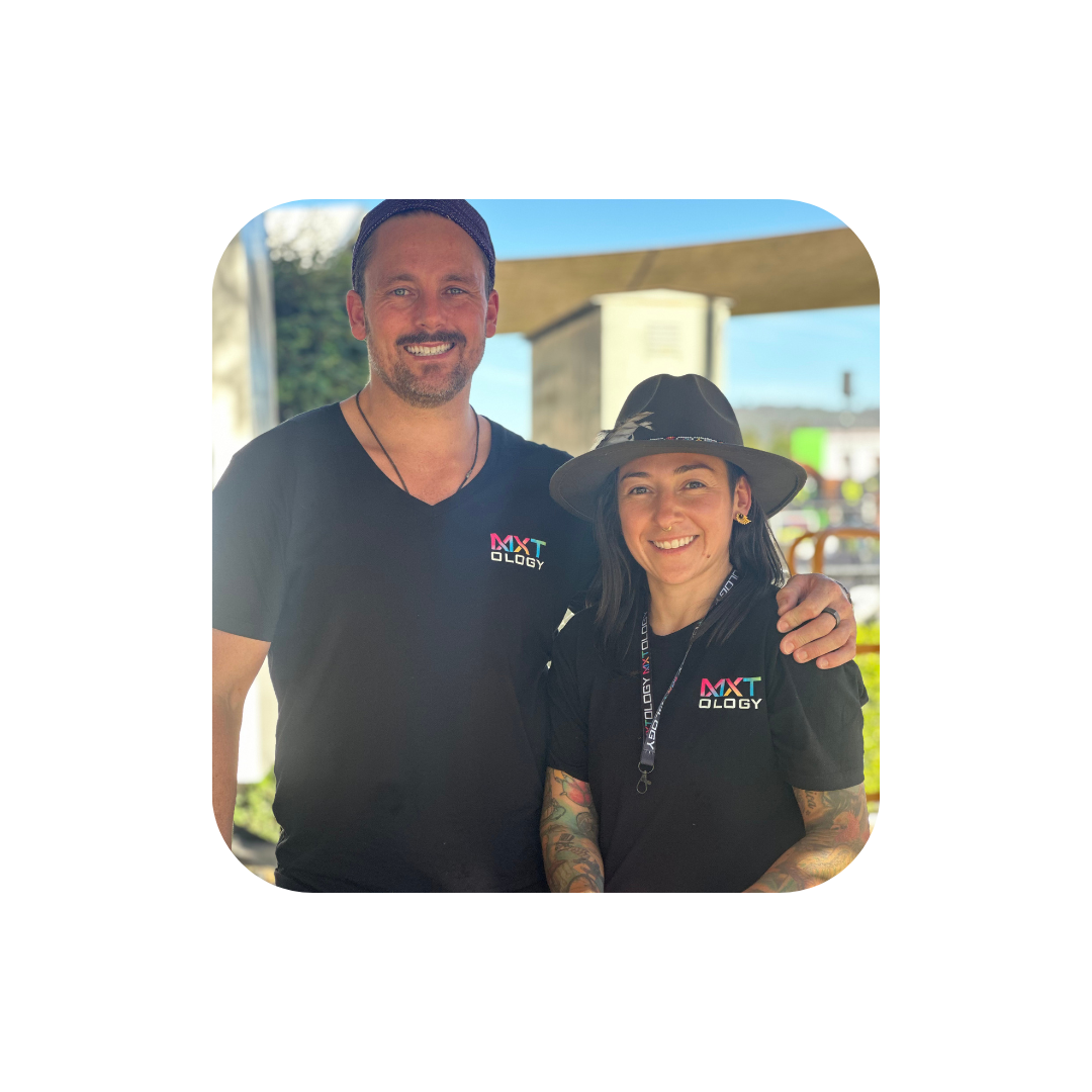 Australian founders of MXTology smiling at outdoor event, representing local business and fresh cocktail innovation.
