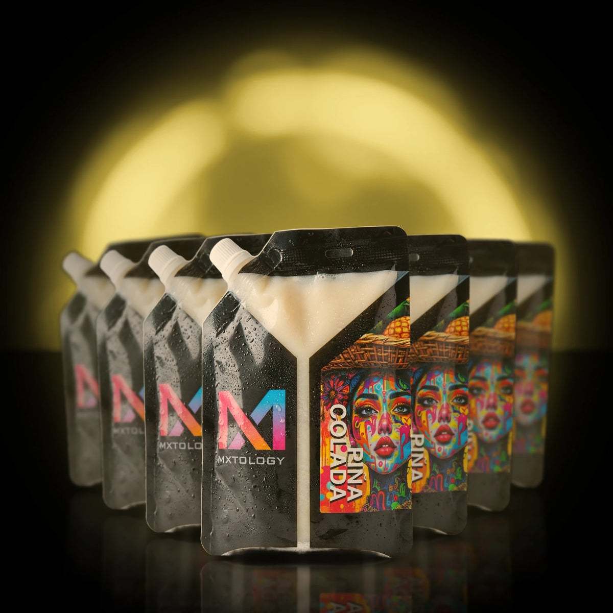 MXTOLOGY Pina Colada 10-pack stacked under neon light