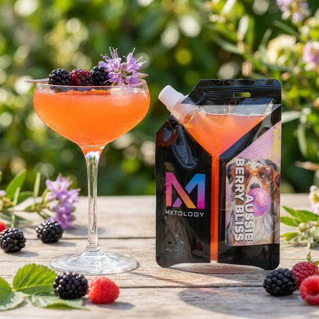 Aussie Berry Bliss cocktail beside the MXTOLOGY pouch